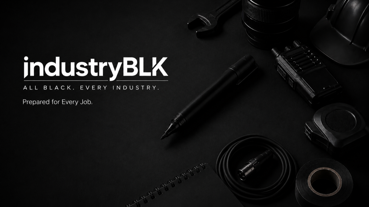 Black professional tools arranged on an IndustryBLK work surface